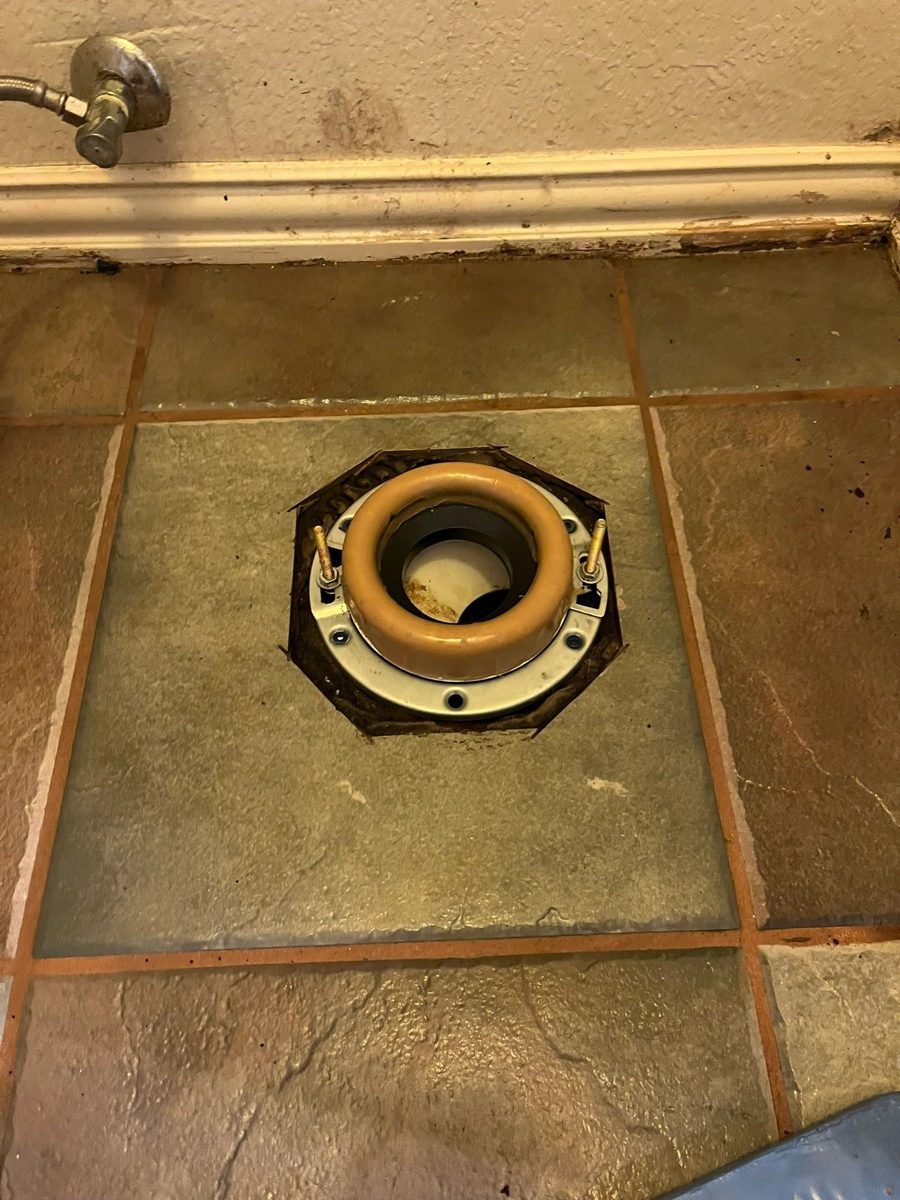Toilet flange being repaired