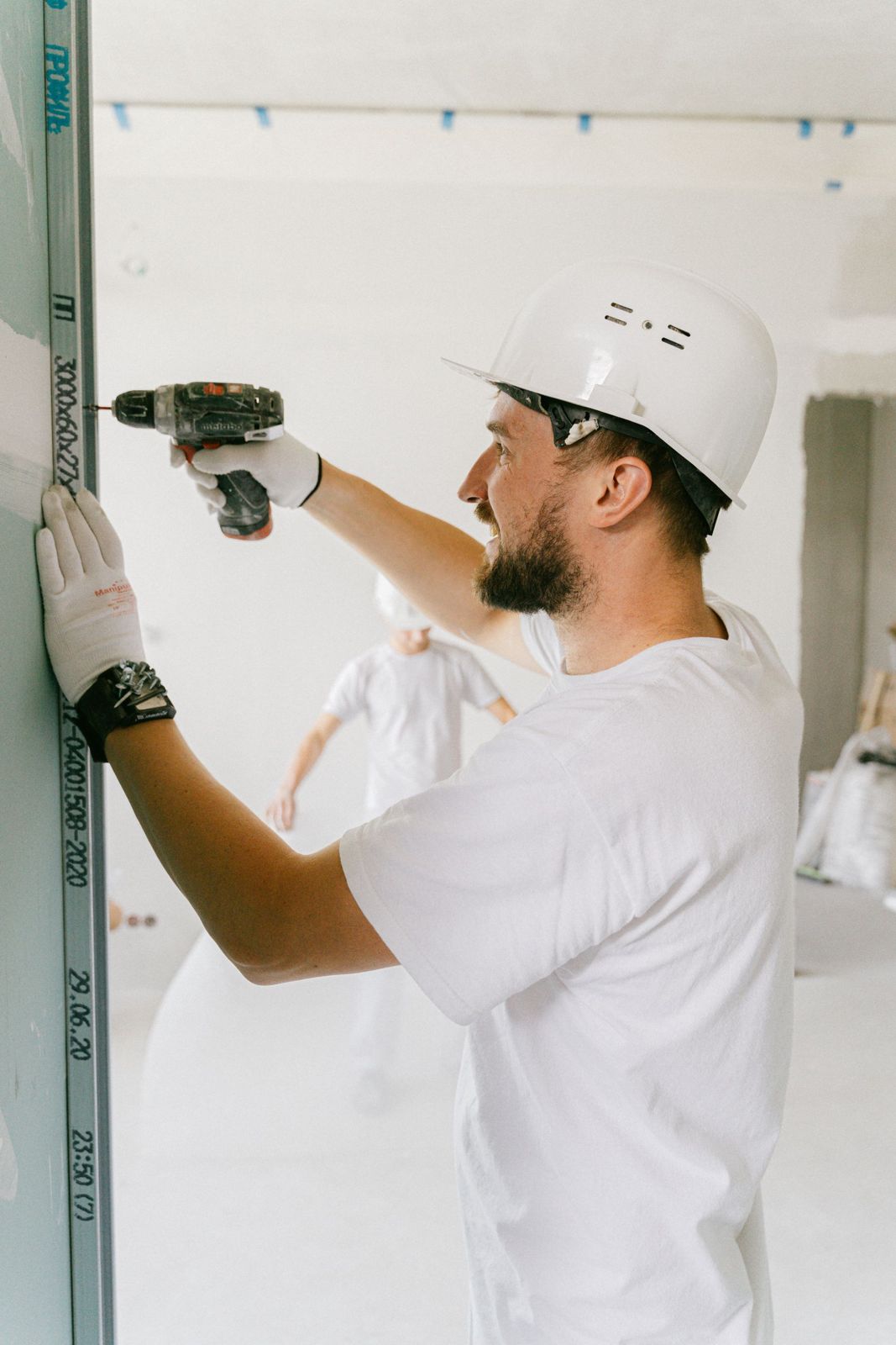 Tradesman using a drill during a home repair